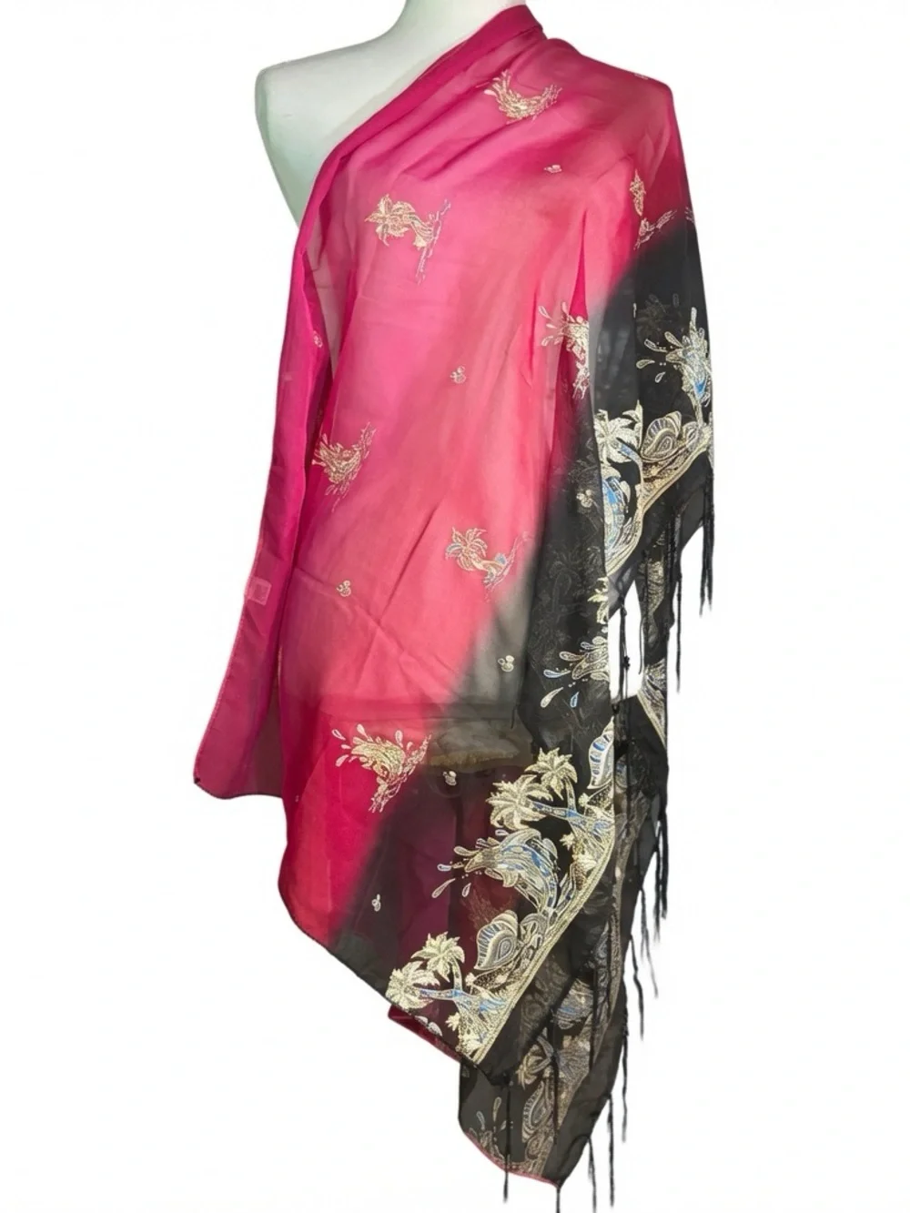 magenta and black scarf features palm tree motifs and black tassels along the ed